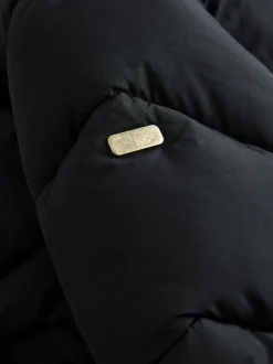 Zwart - Regenbestendige gewatteerde jas met capuchon en imitatiebontvoering (3 - 16 jr)