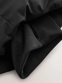 Zwart - Regenbestendige gewatteerde jas met microfleece voering (3-17jr)