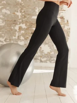 Zwart - Superzachte Dry Tech yogasportleggings met uitlopende pijpen