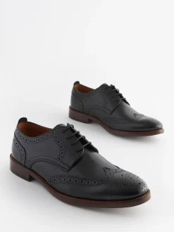 Zwart - Wijde pasvorm - Brogues van leer met contrasterende zool