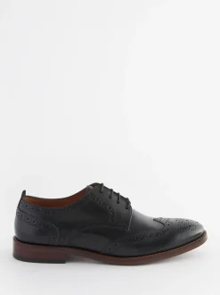 Zwart - Wijde pasvorm - Brogues van leer met contrasterende zool