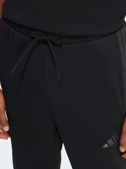 Zwart Ground - adidas Essentials fleece joggingbroek met 3 strepen