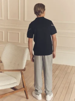 Zwarte ruit - Gebreid poloshirt met rits bij de hals (3-16jr)